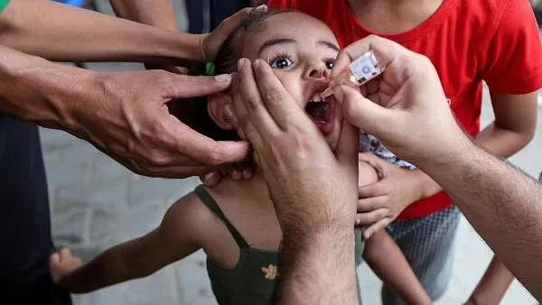 A Palestinian girl is vaccinated against polio