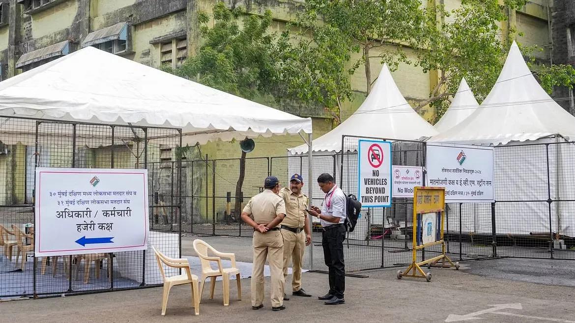 Security personnel stand guards at Lok Sabha elections, in Mumbai