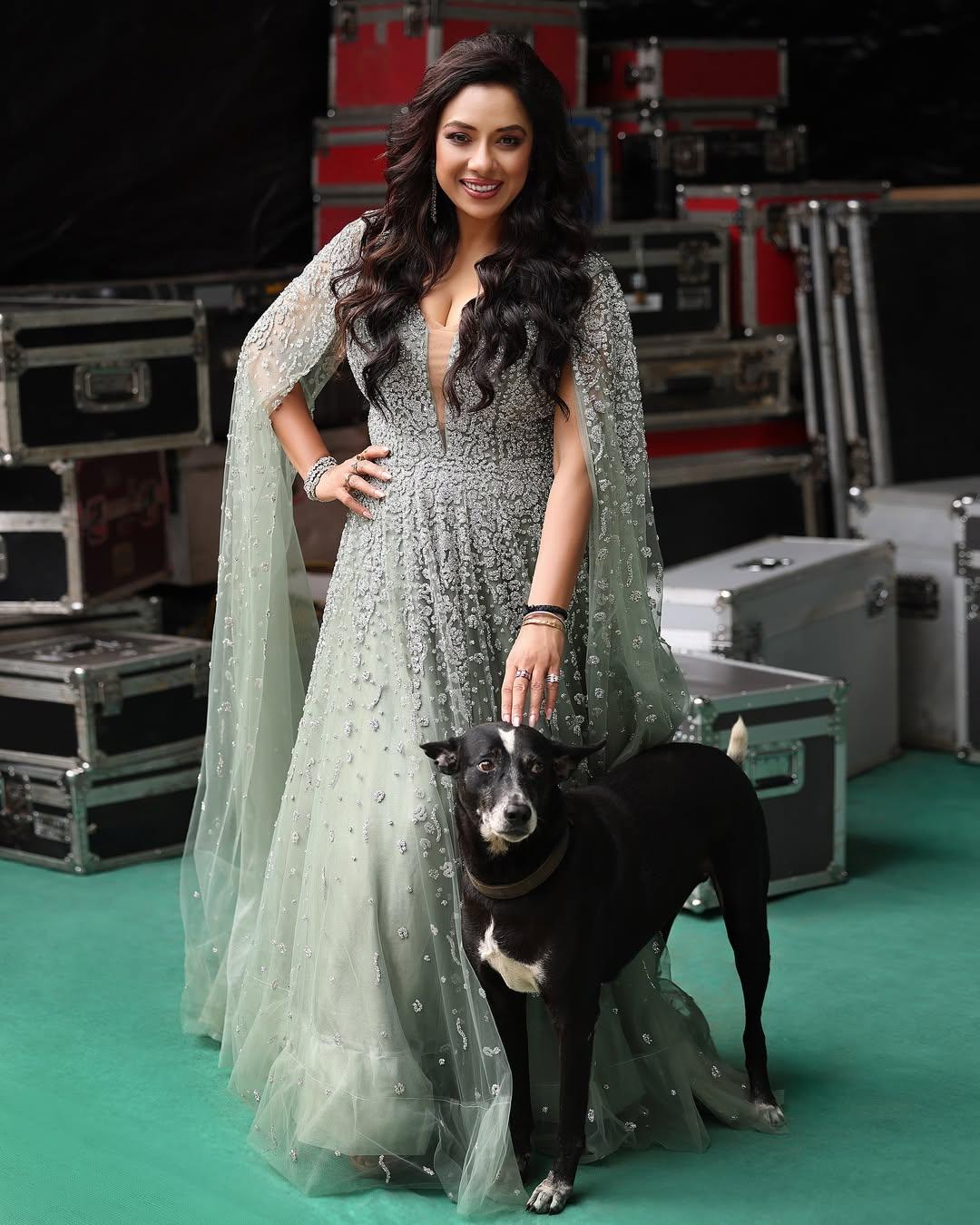 Rupali Ganguly is joined by one of her 'bachchas' as she poses for some solos