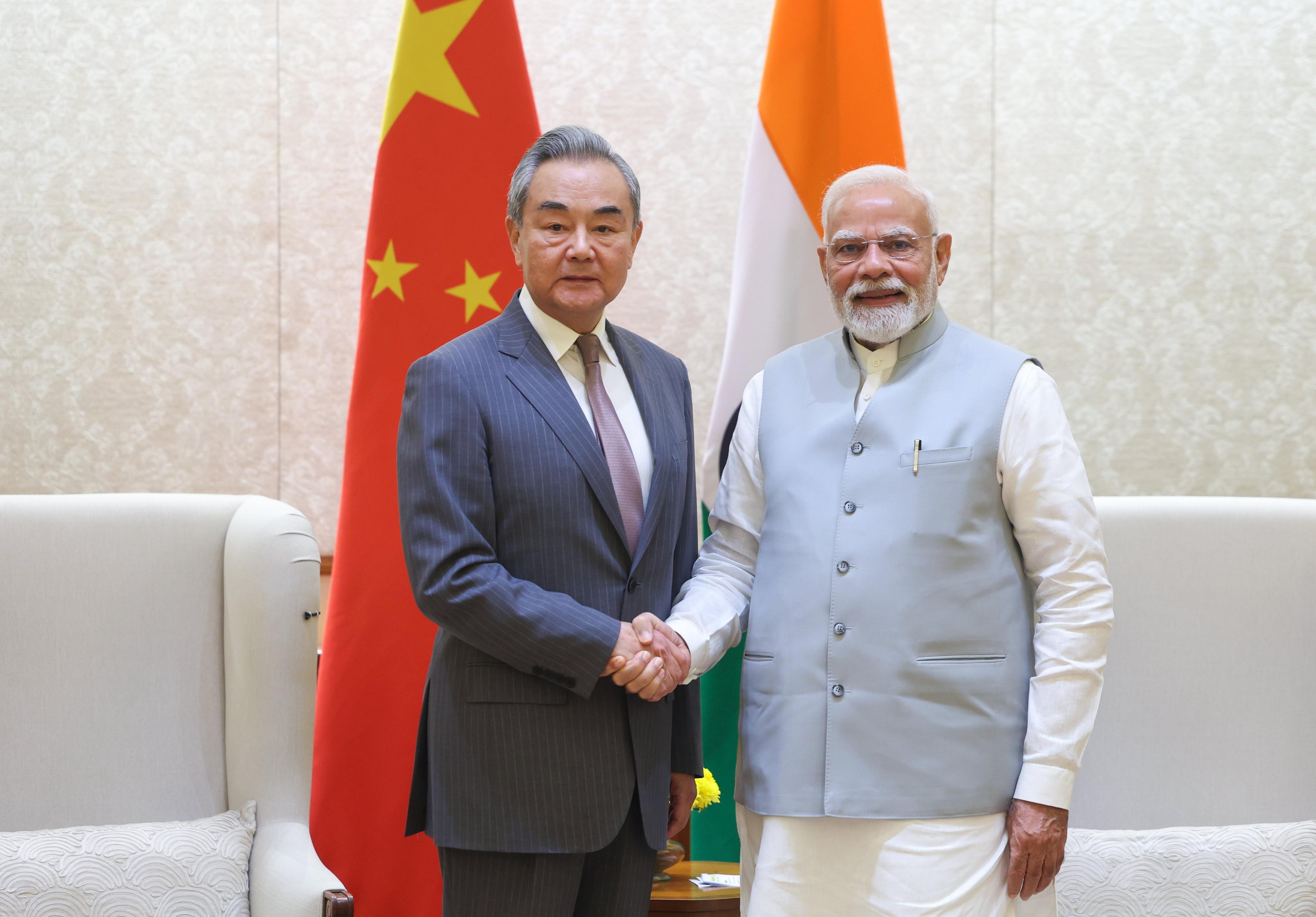 Chinese Foreign Minister Wang Yi calls on PM Modi