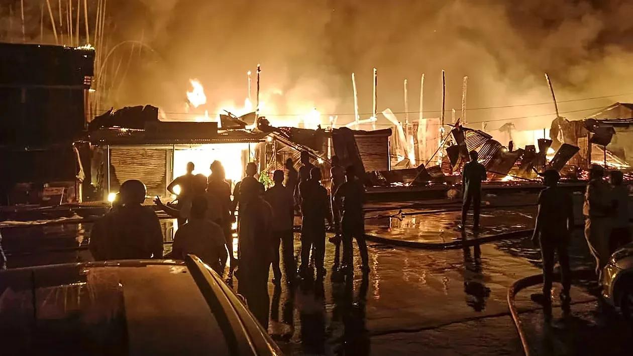 Flames and smoke rise after a fire broke out in Rangat Market