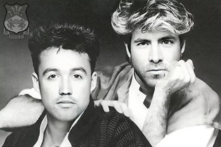 Ryan Reynolds and Robert McElhenney mimic Wham! stars George Michael and Andrew Ridgeley.