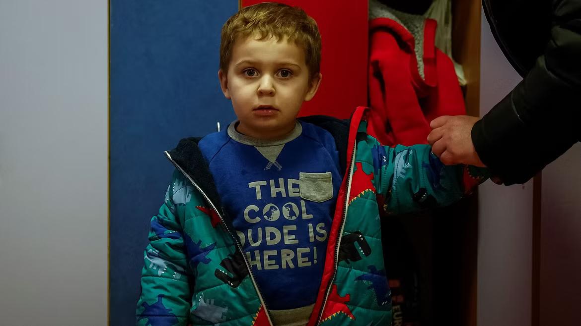 Yevhen Stepanenko, 2-years-old, stands in a kindergarden, Ukraine