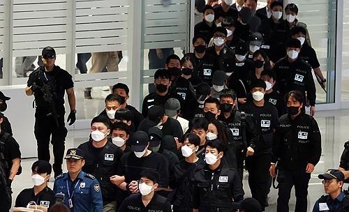 Cambodia deports 64 South Korean online scam suspects