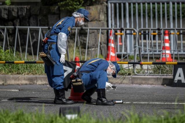 Police investigating outside the headquarters of LDP